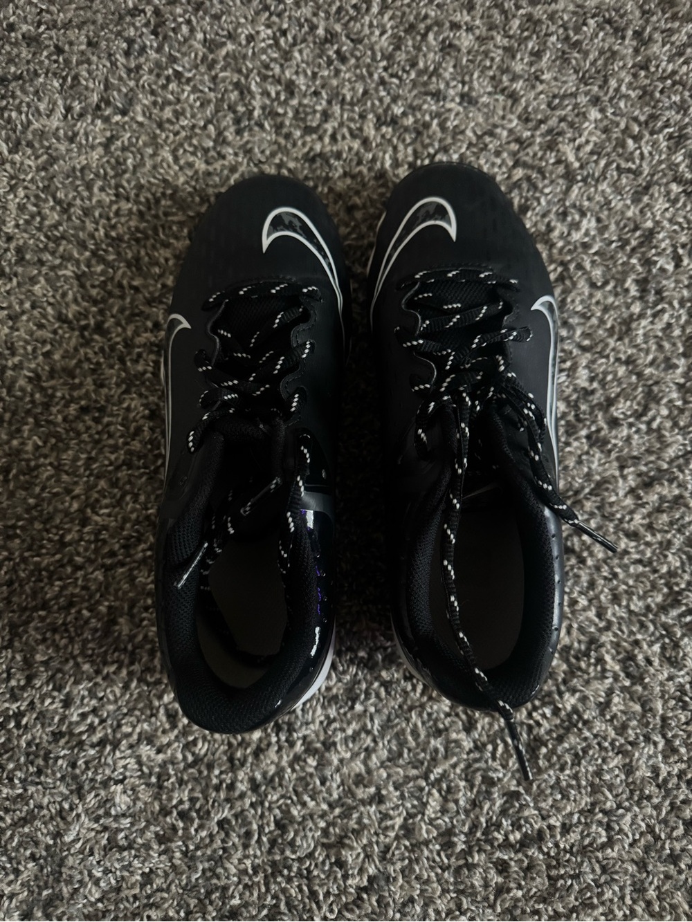 Nike Black Athletic Cleats with White Swoosh Accents